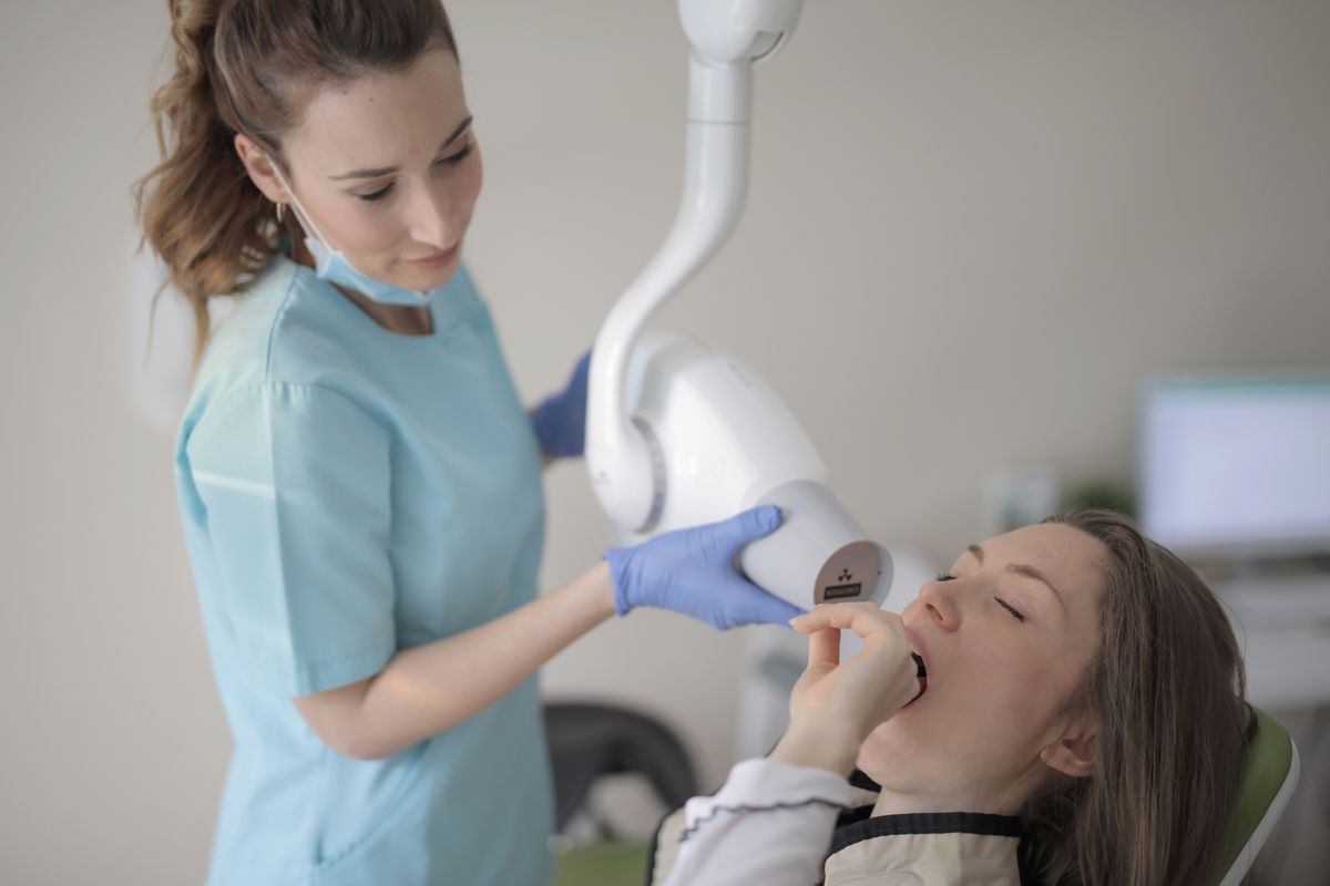 Dentist working with a patient in a modern clinic