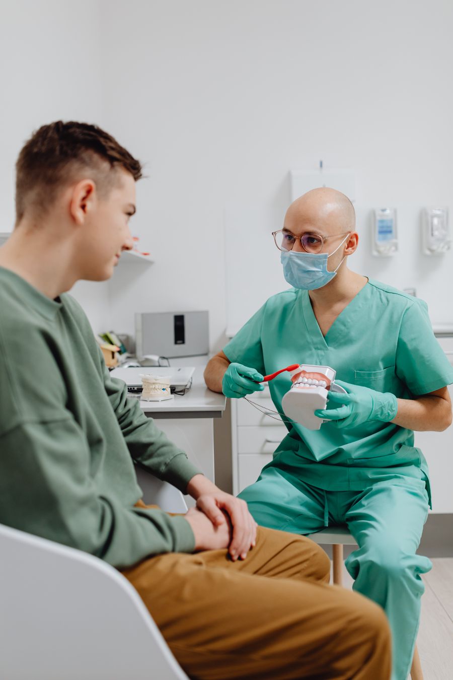 Dentist consulting with a patient